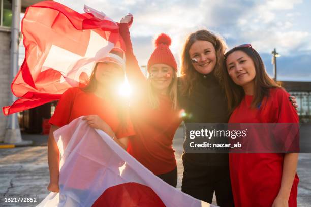 group of supporters rejoices holding flag. - new zealand stadium stock pictures, royalty-free photos & images