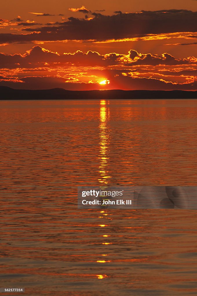 Midnight sun across water
