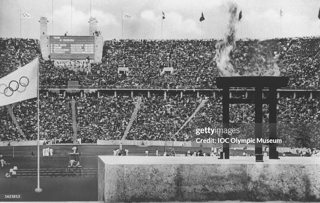 General view of the Olympic Stadium with the Olympic Flame burning in the foreground