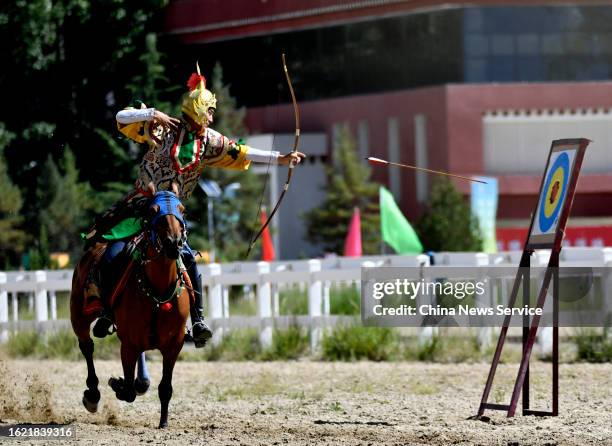 Rider demonstrates his mounted archery skills during the traditional Shoton Festival on August 17, 2023 in Lhasa, Tibet Autonomous Region of China.