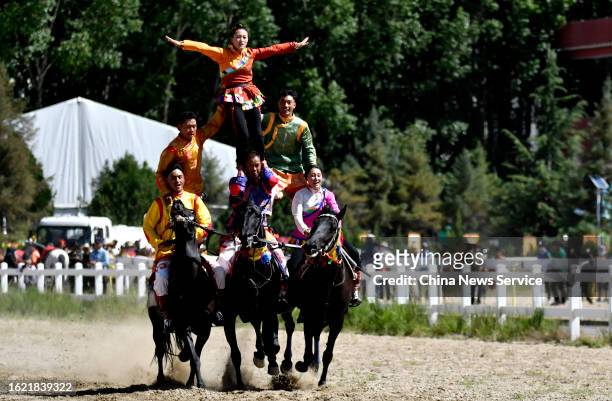Riders demonstrate their equestrian skills during the traditional Shoton Festival on August 17, 2023 in Lhasa, Tibet Autonomous Region of China.