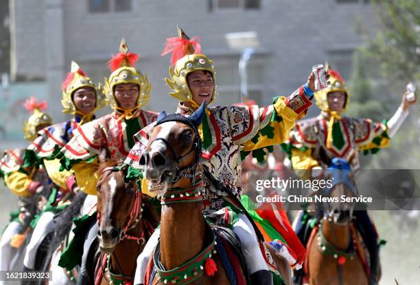 Riders greet audience during the traditional Shoton Festival on August 17, 2023 in Lhasa, Tibet Autonomous Region of China.