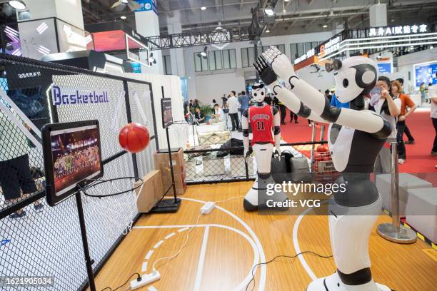 Robot shoots basketball during 2023 World Robot Conference at Beijing Etrong International Exhibition & Convention Center on August 16, 2023 in...