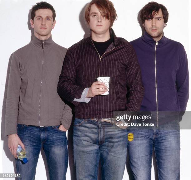 Keane pose for a group portrait backstage at a TV show, London, 2004. L-R Richard Hughes, Tom Chaplin and Tim Rice-Oxley.