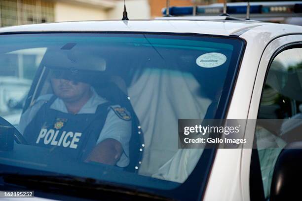 Oscar Pistorius is transported to the Pretoria Magistrate Court on February 20, 2013 for the second day of his bail hearing in Pretoria, South...