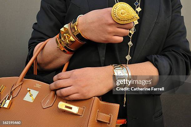 Amar Hussain , Pakastani stylist wearing an Alexandrer Mc Queen First Collection coat, accessorised with Van Cleef and Arepels neck chains and...