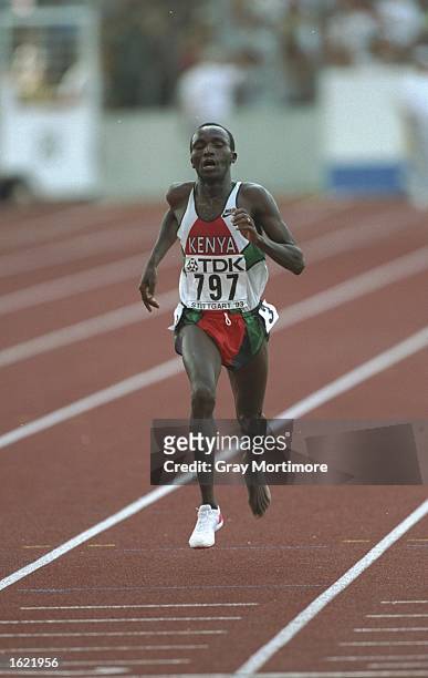 Moses Tanui of Kenya races for the finishing line with only one shoe during the 10000 Metres event at the World Championships in Stuttgart, Germany....