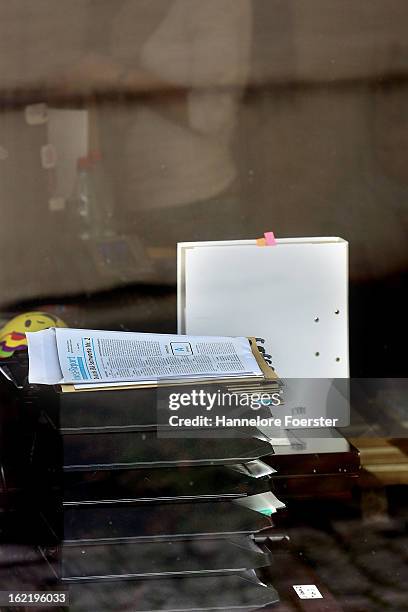 Papers sit inside the headquarters of the S&K investment group the day after police raided the company's offices on February 20, 2013 in Frankfurt,...