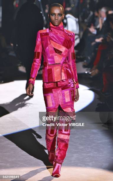 Model walks the runway at the Tom Ford Ready to Wear Fall/Winter 2013-2014 show during London Fashion Week Fall/Winter 2013/14 at on February 18,...