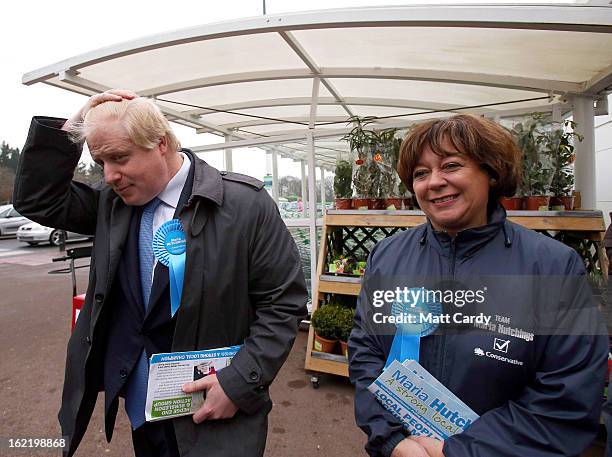 Mayor Of London Boris Johnson brushes his hair as he arrives at an ASDA superstore with Conservative candidate Maria Hutchings during a visit to the...