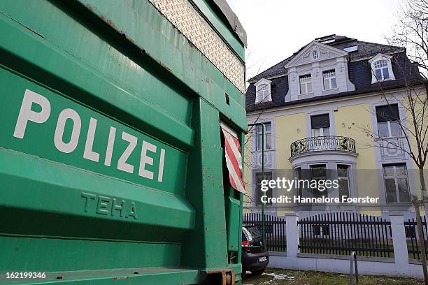 Police cars stand outside the headquarters of the S&K investment group the day after police raided the company's offices on February 20, 2013 in...