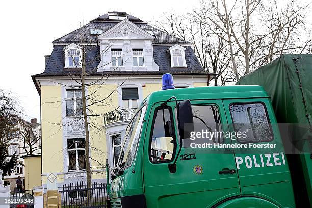 Police cars stand outside the headquarters of the S&K investment group the day after police raided the company's offices on February 20, 2013 in...