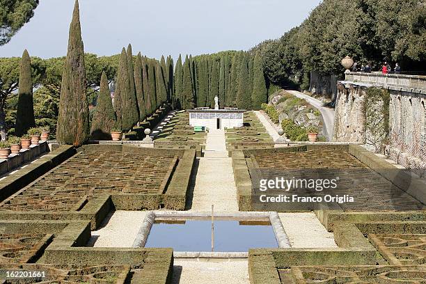 People stand above the gardens of the Pontifical residence of Castelgandolfo are seen on February 20, 2013 in Rome, Italy. The Apostolic Palace and...