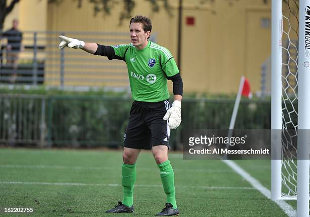 Goalie Troy Perkins of the Montreal Impact directs play against DC United February 16, 2013 in the third round of the Disney Pro Soccer Classic in...