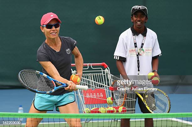 Cara Black of Zimbabwe helps with a disabled coaching clinic during day three of the WTA Dubai Duty Free Tennis Championship on February 20, 2013 in...