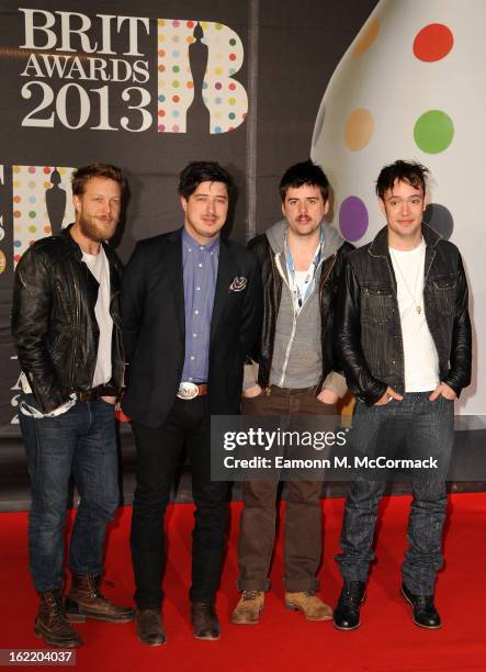 Ted Dwane, Marcus Mumford, Winston-Marshall and Ben Lovett of Mumford & Sons attend the Brit Awards 2013 at the 02 Arena on February 20, 2013 in...