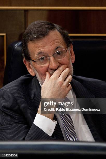 Spain's Prime Minister Mariano Rajoy listens as opposition Party leader Alfredo Perez Rubalcaba delivers a speech during the first State of Nation...