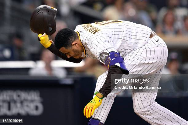 Manny Machado of the San Diego Padres slams his helmet after striking out during the fifth inning against the Arizona Diamondbacks at PETCO Park on...