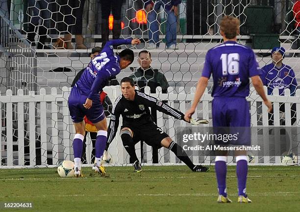 Forward Long Tan of Orlando City shoots on goalie Andy Gruenebaum of the Columbus Crew February 16, 2013 in the third round of the Disney Pro Soccer...