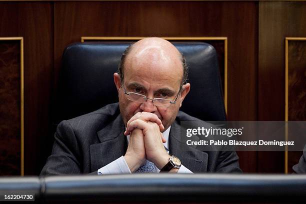 Spain's Economy and Competitiveness Minister Luis de Guindos listens during Mariano Rajoy's first State of Nation Debate as Prime Minister at...