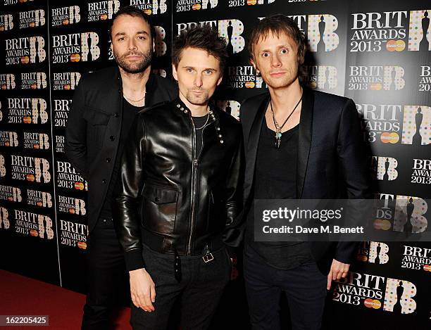 Chris Wolstenholme, Matt Bellamy and Dominic Howard of Muse arrive at the BRIT Awards 2013 at the O2 Arena on February 20, 2013 in London, England.