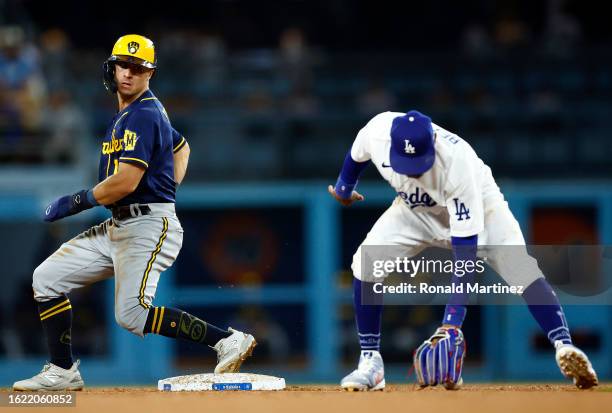 Sal Frelick of the Milwaukee Brewers steals second base against the Los Angeles Dodgers in the fourth inning at Dodger Stadium on August 17, 2023 in...