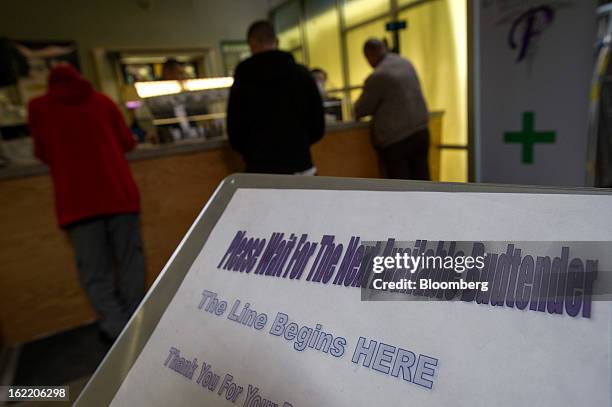 Customers purchase items at Palliative Health Center medical-marijuana shop in San Jose, California, U.S., on Thursday, Feb. 7, 2013. The dispensary,...