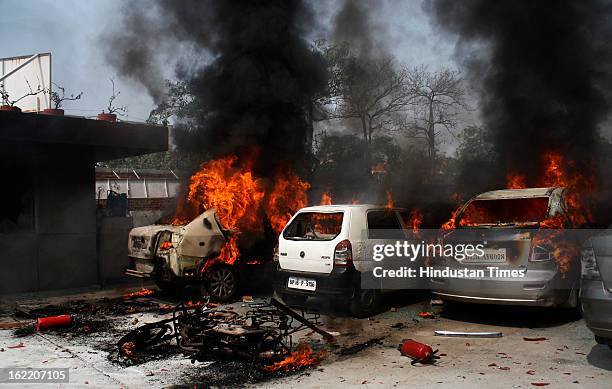 Vehicles set fire by the angry mob as they protest during the two-day nationwide strike called by various trade unions to protest against...