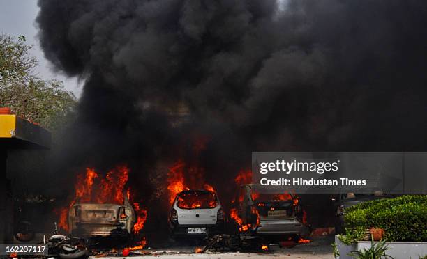 Vehicles set fire by the angry mob as they protest during the two-day nationwide strike called by various trade unions to protest against...