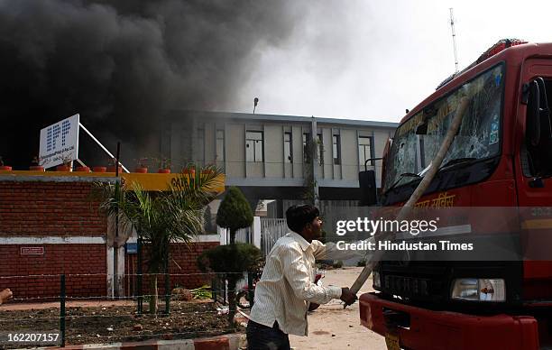 Vehicles set fire by the angry mob as they protest during the two-day nationwide strike called by various trade unions to protest against...