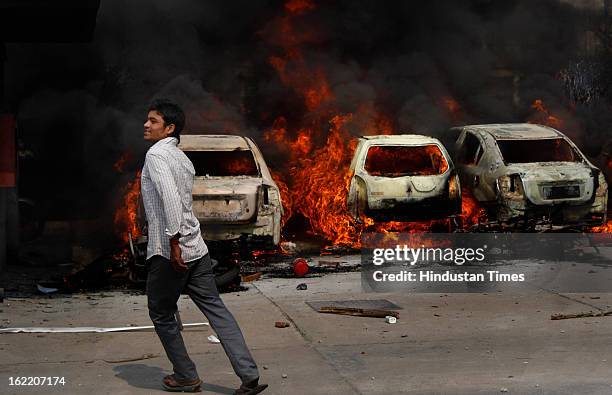 Vehicles set fire by the angry mob as they protest during the two-day nationwide strike called by various trade unions to protest against...