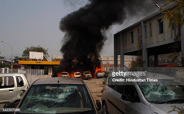 Vehicles set fire by the angry mob as they protest during the two-day nationwide strike called by various trade unions to protest against...