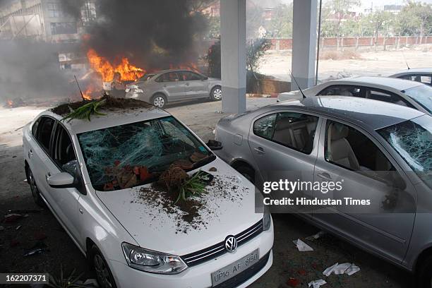 Vehicles set fire by the angry mob as they protest during the two-day nationwide strike called by various trade unions to protest against...