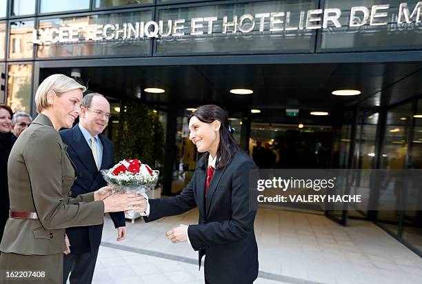 Princess Charlene and Prince Albert II of Monaco visit the new "Lycee Technique et Hotelier de Monaco" on February 20, 2013 in Monaco. AFP PHOTO /...