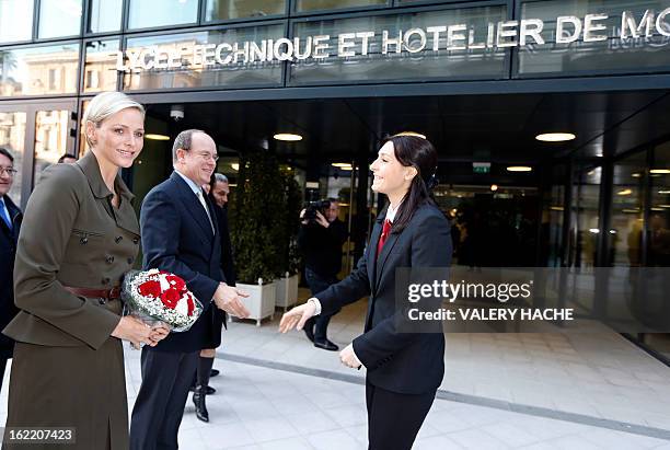 Princess Charlene and Prince Albert II of Monaco visit the new "Lycee Technique et Hotelier de Monaco" on February 20, 2013 in Monaco. AFP PHOTO /...