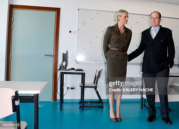 Prince Albert II of Monaco and Princess Charlene visit a classroom of the new "Lycee Technique et Hotelier de Monaco" on February 20, 2013 in Monaco....