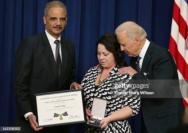 Vice President Joseph Biden and Attorney General Eric Holder give the Medal of Valor to Angela Miller, widow of fallen Pennsylvania State Trooper...