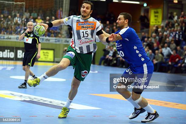 Dennis Krause of Gummersbach defends against Michael Haass of Goeppingen during the DKB Handball Bundesliga match between VfL Gummersbach and...