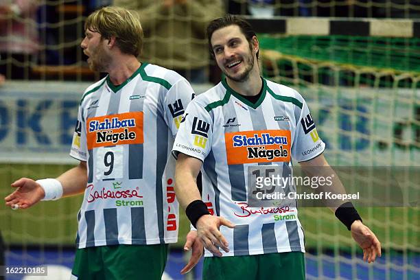 Manuel Spaeth and Michael Haass of Goeppingen look thoughtful during the DKB Handball Bundesliga match between VfL Gummersbach and FrischAuf...