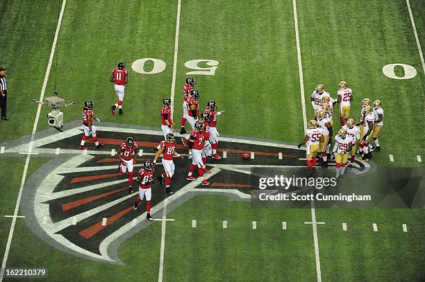 Members of the Atlanta Falcons head to the line of scrimmage against the San Francisco 49ers during the NFC Championship game at the Georgia Dome on...