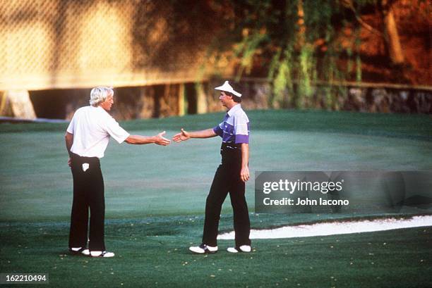 Larry Mize victorious, shaking hands after making chip on No 11 hole during playoff vs Greg Norman and winning tournament on Sunday at Augusta...