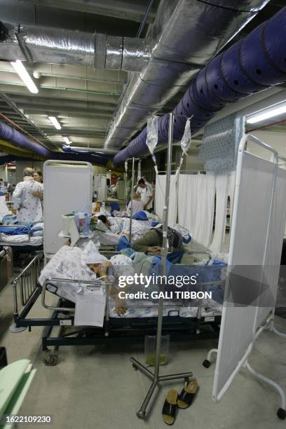 Patients from the cardiology and oncology departments are seen after they were transferred to the shelter of the Rambam hospital where a makeshift...