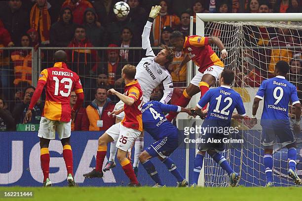 Goalkeeper Timo Hildebrand of Schalke is challenged by Didier Drogba of Galatasaray during the UEFA Champions League Round of 16 first leg match...