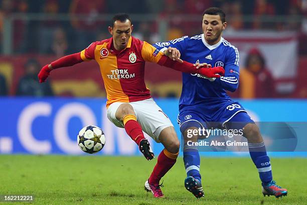 Umut Bulut of Galatasaray is challenged by Sead Kolasinac of Schalke during the UEFA Champions League Round of 16 first leg match between Galatasaray...