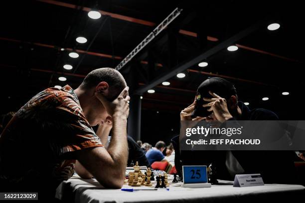 People compete in the 96th French chess championship on August 25, 2023 in L'Alpe d'Huez.