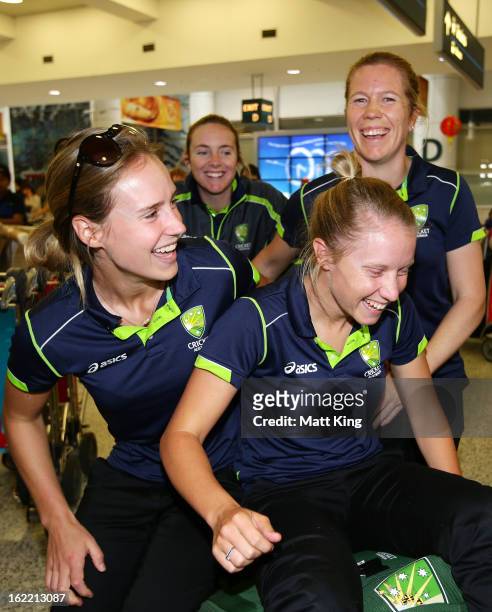 Ellyse Perry, Sarah Coyte, Alyssa Healy and Alex Blackwell of the Australian women's cricket team share a laugh after arriving home following their...