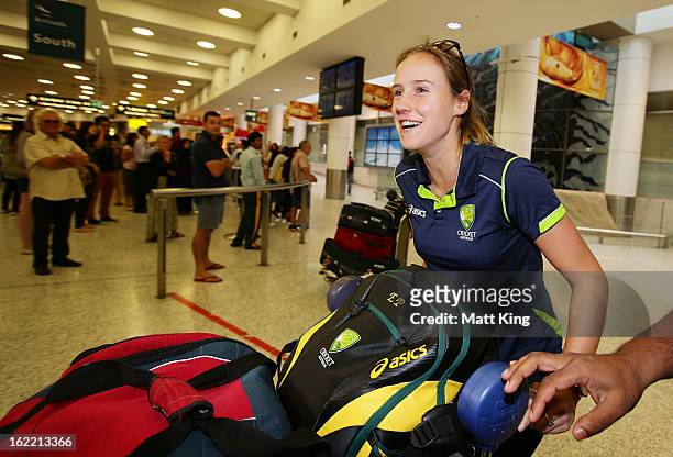 Ellyse Perry of the Australian women's cricket team arrives home following their win in the 2013 World Cup at Sydney International Airport on...