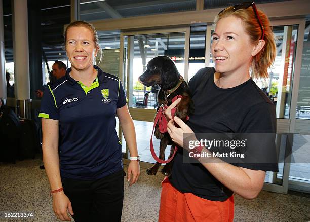 Alex Blackwell of the Australian women's cricket team is greeted by her twin sister Kate Blackwell after arriving home following their win in the...