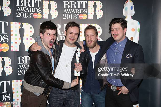 Winston-Marshall, Ben Lovett, Ted Dwane and Marcus Mumford of Mumford & Sons pose with their British Group award in the press room at the Brit Awards...