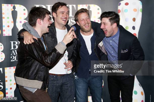 Winston-Marshall, Ben Lovett, Ted Dwane and Marcus Mumford of Mumford & Sons pose with their British Group award in the press room at the Brit Awards...